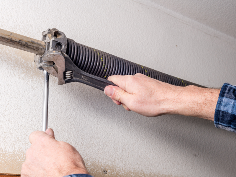 An-image-showing-garage-door-spring-repair-by-Proffitts-Garage-Door-Repair-and-Install