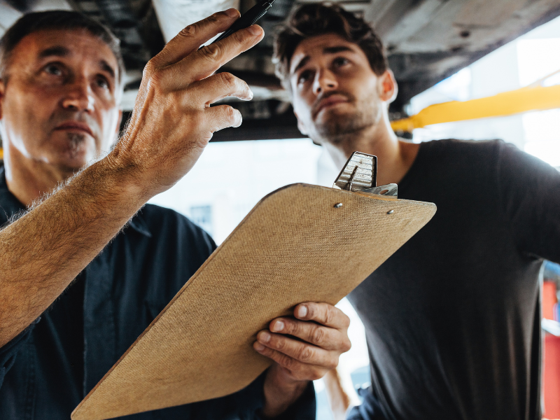 Image of a professional garage door repair assessment being performed by expert technicians in Tennessee.